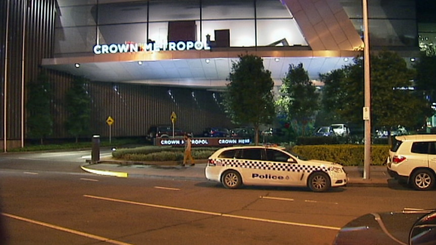 Police at Melbourne's Crown Metropol hotel on Sunday.