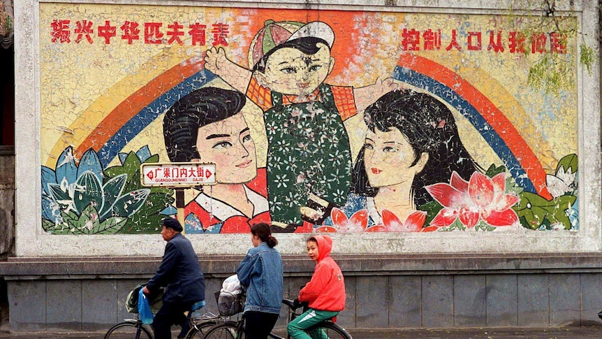 A decaying mural in Beijing promotes the Chinese one-child policy.