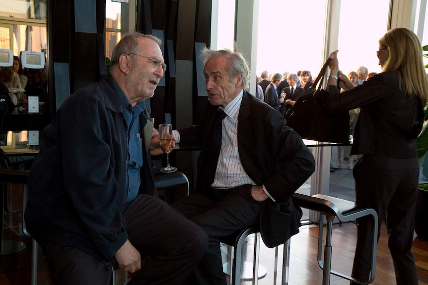 Former legendary newspaper editor Sir Harold Evans at a bar.