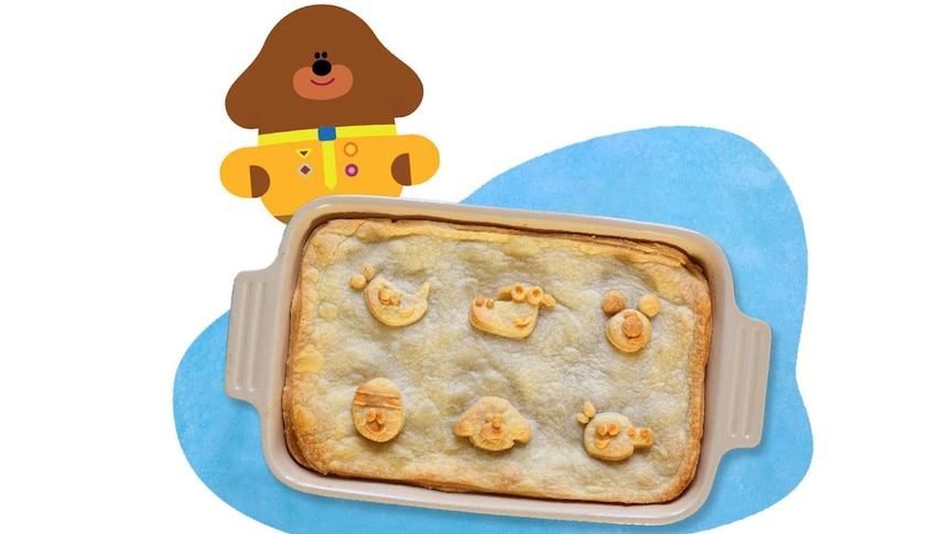 Baked apple pie with Hey Duggee characters in the pastry topping