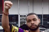Dallas shootings suspect Micah Johnson with his fist raised in what is known as the "black power" stance.