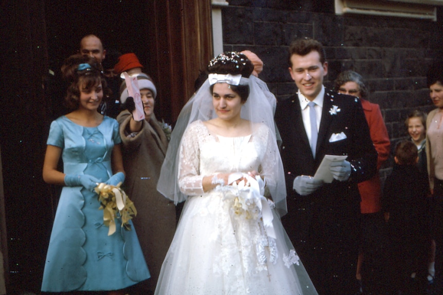 Maria James leaves the church with her new husband, John, on her wedding day.