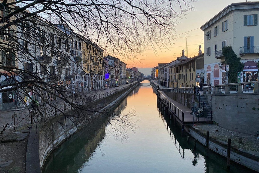 Navigli canal with empty streets on either side.