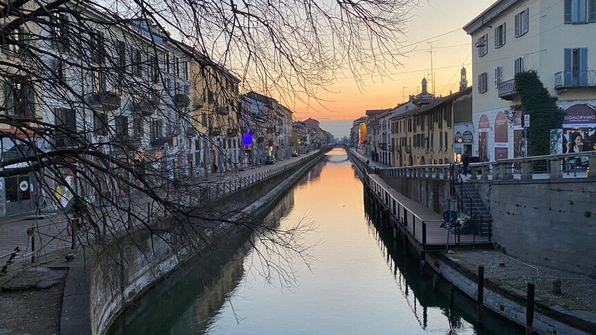Navigli canal with empty streets on either side.