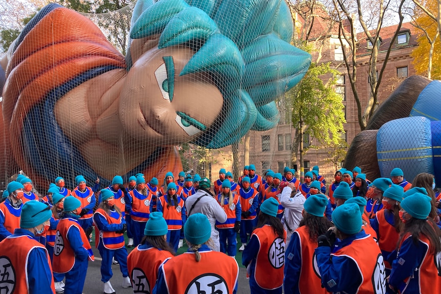 An inflated Goku at a parade. 