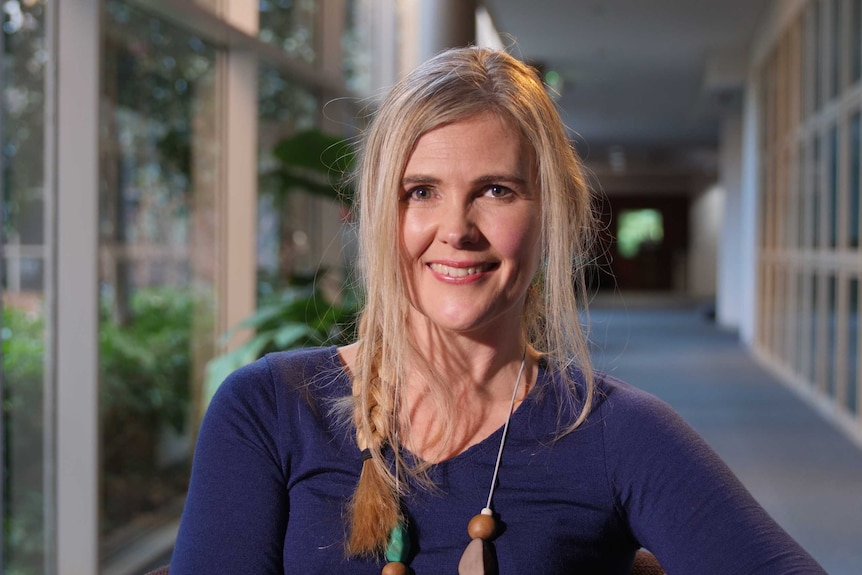 Psychologist, Sarah Purvey, smiles at the camera.