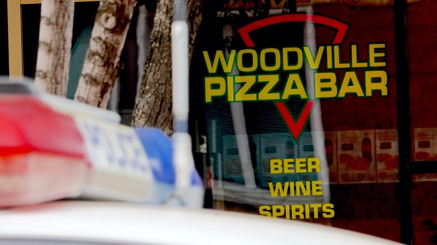 A police car sits outside of the Woodville Pizza Bar in Adelaide