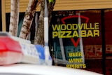 A police car sits outside of the Woodville Pizza Bar in Adelaide