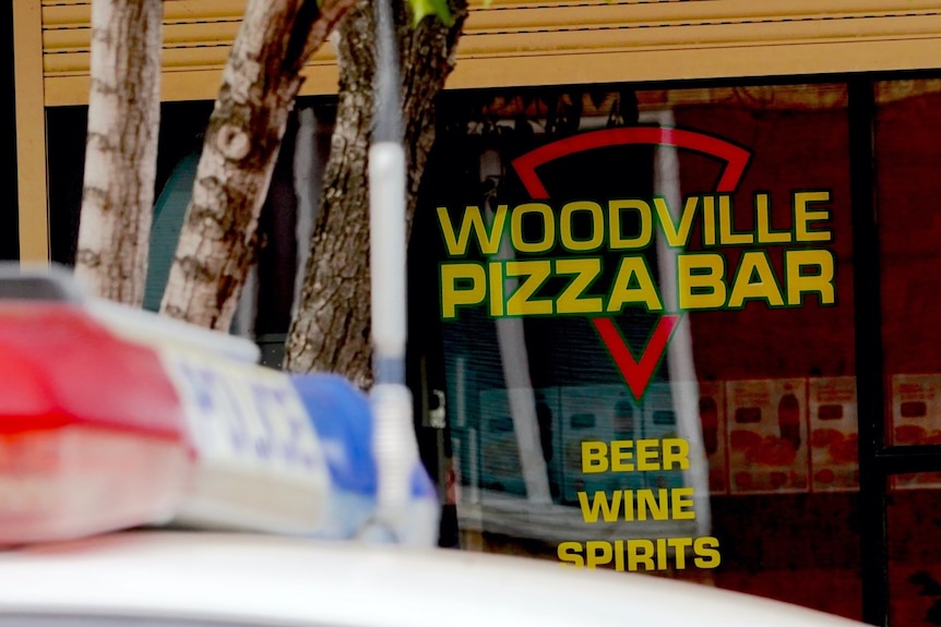 A police car sits outside of the Woodville Pizza Bar in Adelaide