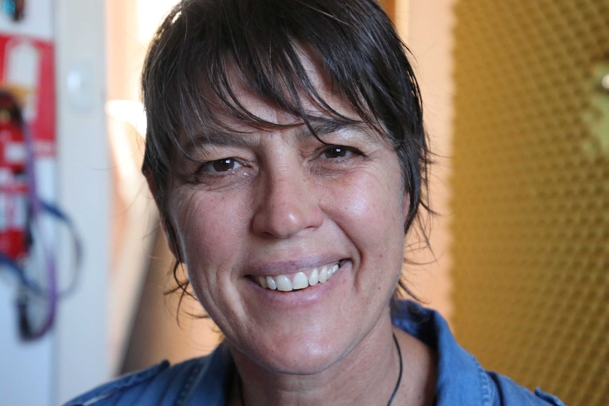 A tight head shot of a smiling Zoe Goss.