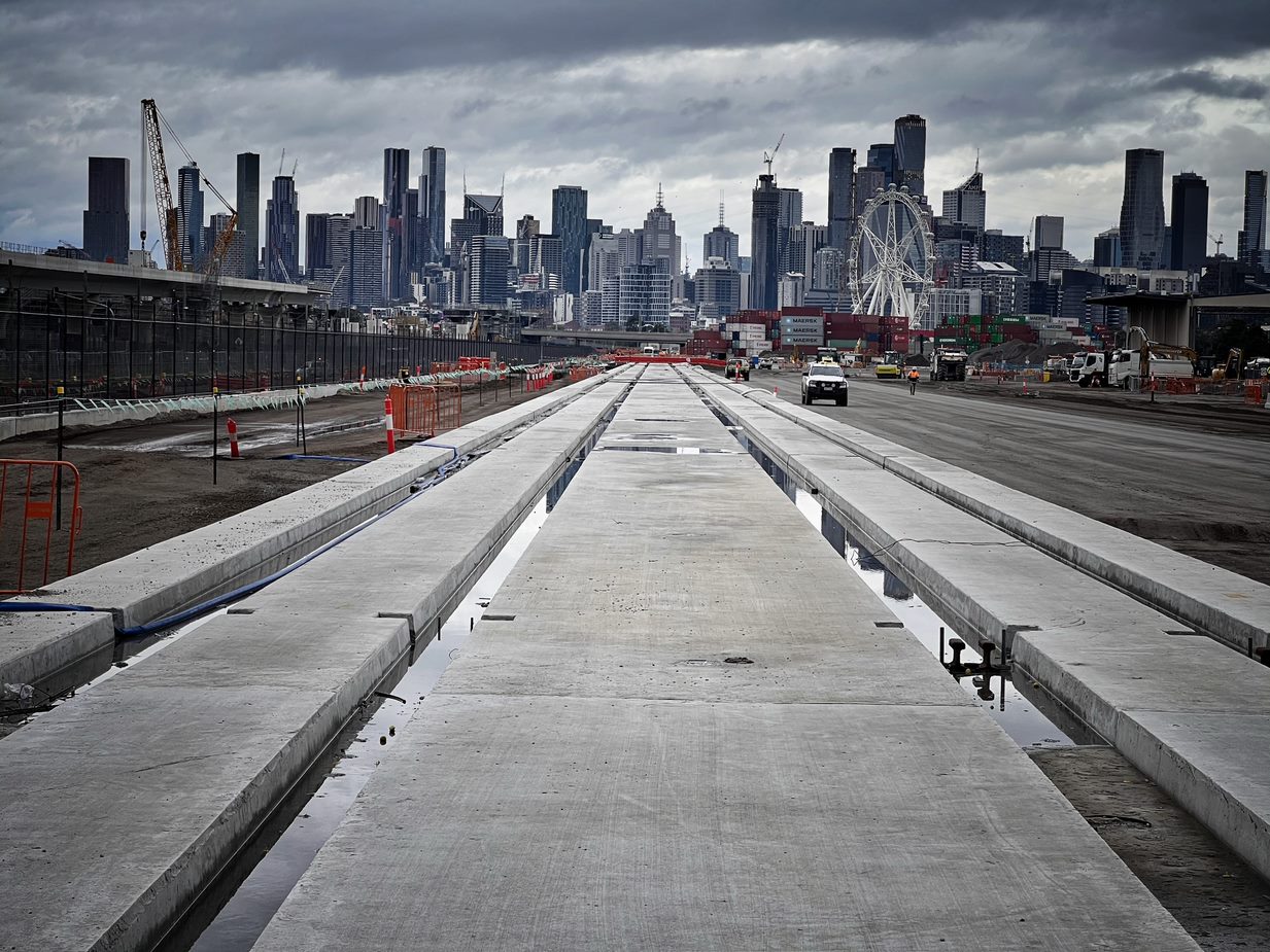Construction underway with  the Melbourne skyline in the background.
