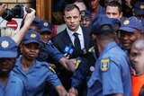 Oscar Pistorius leaving court