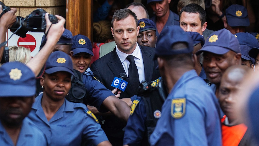 Oscar Pistorius leaving court