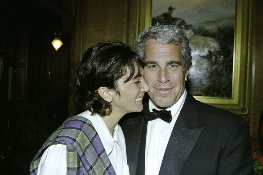 Ghislaine Maxwell grins and rests her face against Jeffery Epstein's face