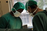 Researchers Dr Yugeesh Lankadeva and Professor Clive May in an operating theatre.