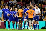 Rugby union player being red carded by the referee during a match 