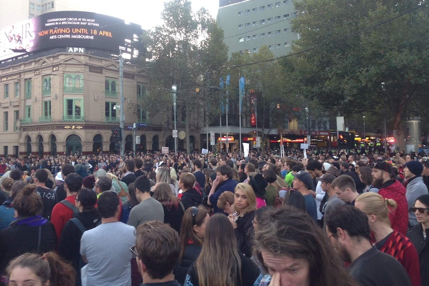 The rally in support of Aboriginal communities has completely blocked the Flinders Street and Swanston Street intersection.