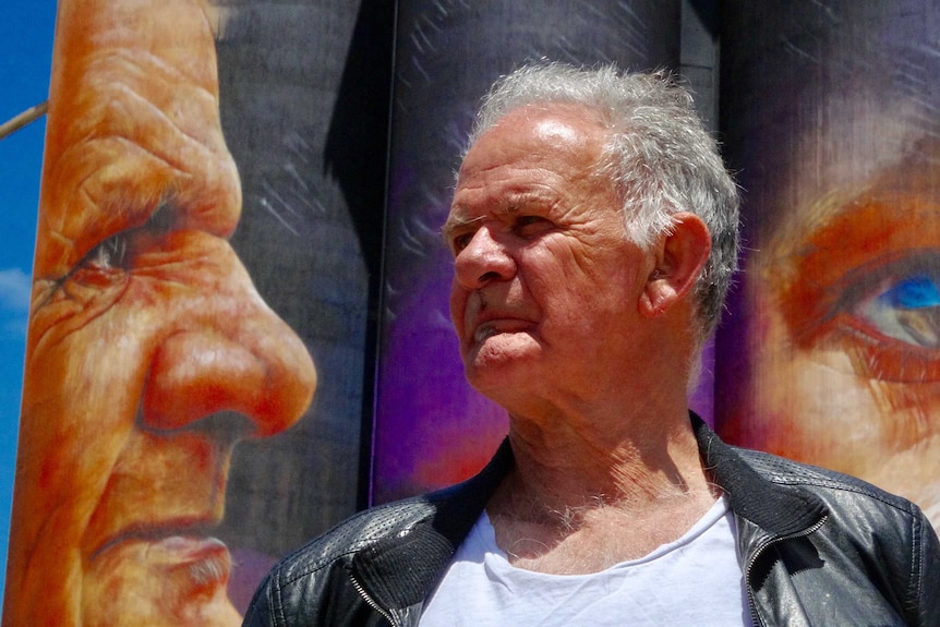 Uncle Ron Marks faces a painting of himself at Sheep Hills.