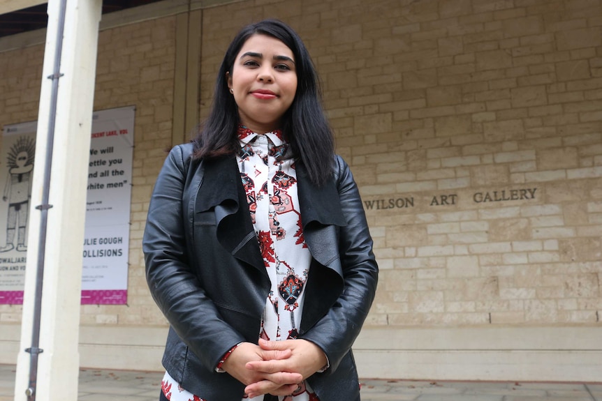 Art curator Hamida Novakovich poses for a picture in front of the Lawrence Wilson Art Gallery at the University of WA.