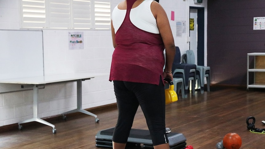 A woman exercising in the gym