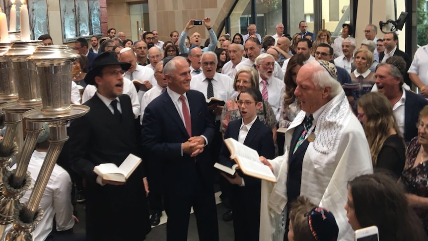 Prime Minister Malcolm Turnbull and his wife Lucy at a Synagogue in Sydney for the seventh night of Chanukah.