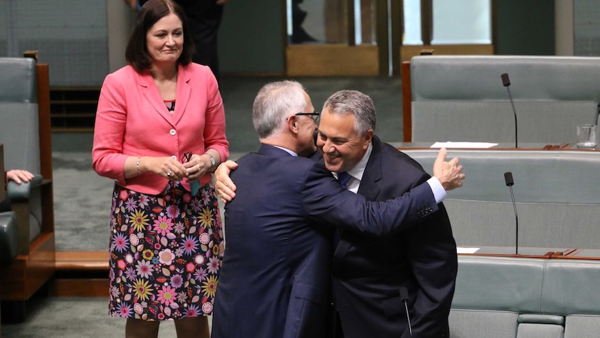 Malcolm Turnbull and Joe Hockey embrace in Parliament