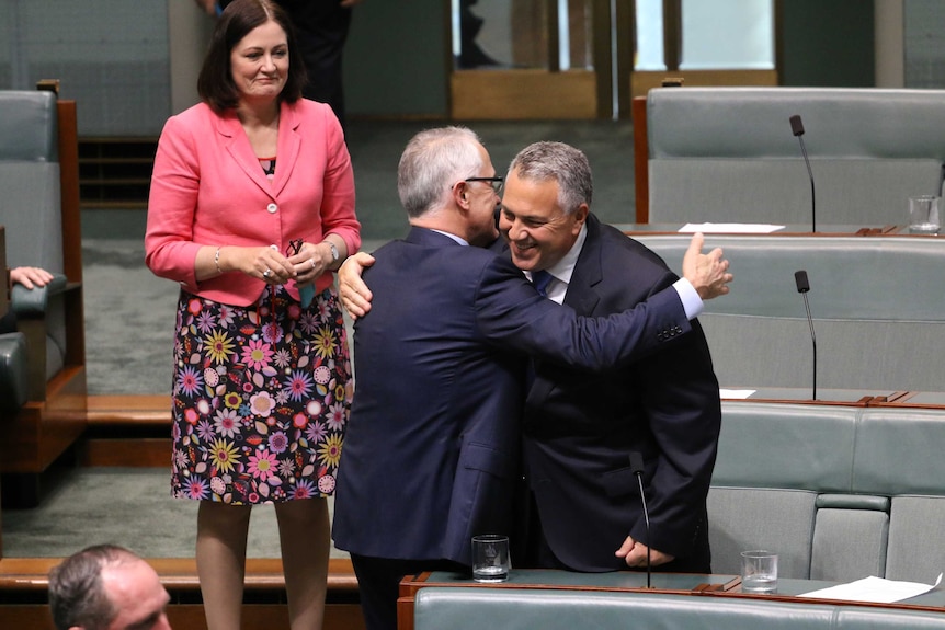 Malcolm Turnbull and Joe Hockey embrace in Parliament