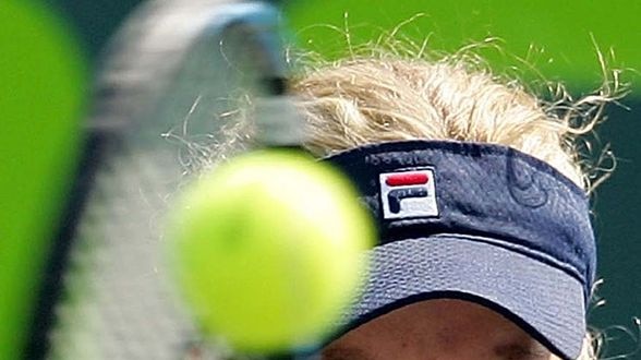 Belgium's Kim Clijsters returns during a tournament