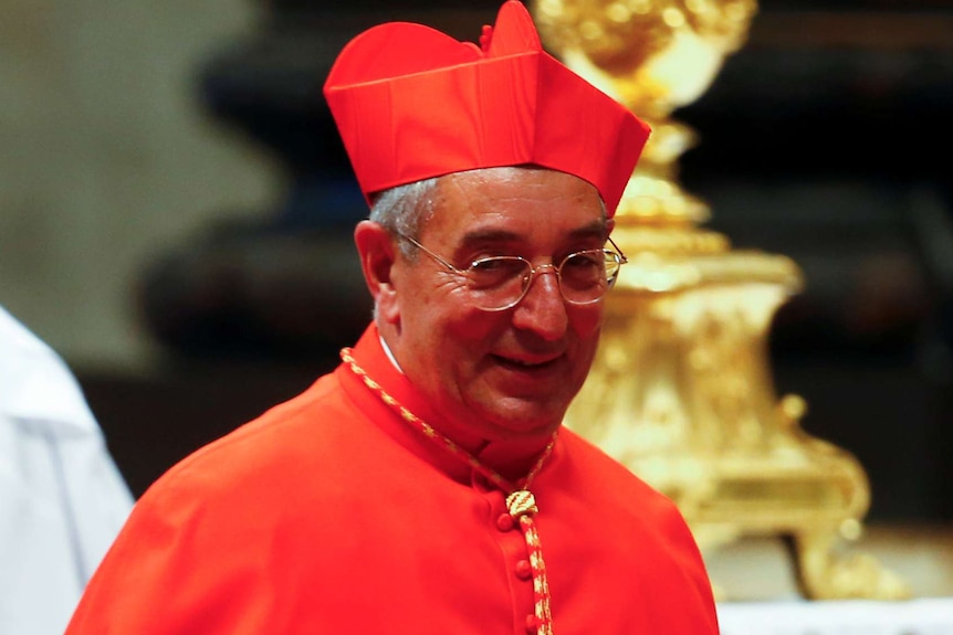 Cardinal Angelo De Donatis smiles during a church ceremony