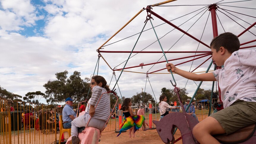 Children on a merry-go-round.