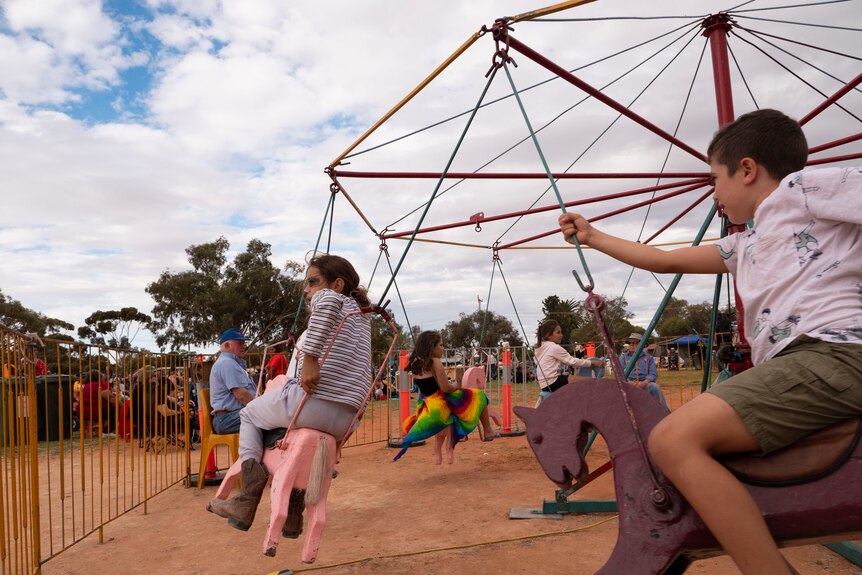 children on a merry-go-round.