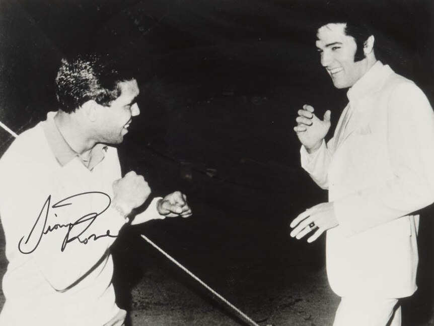 Lionel Rose stands with Elvis Presley.