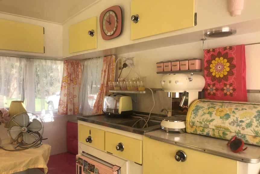 Interior of a caravan with sixties style furniture.