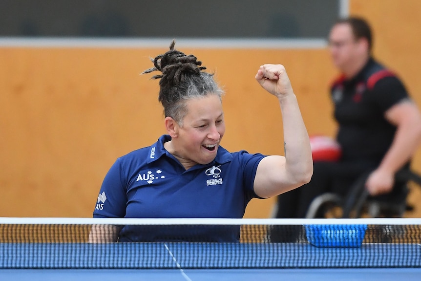 Daniela Di Toro pumps her fist while playing table tennis.