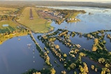 An aerial view of widespread flooding near an air strip.