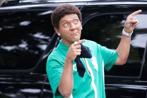 Chris Lilley wearing blackface and a wig.