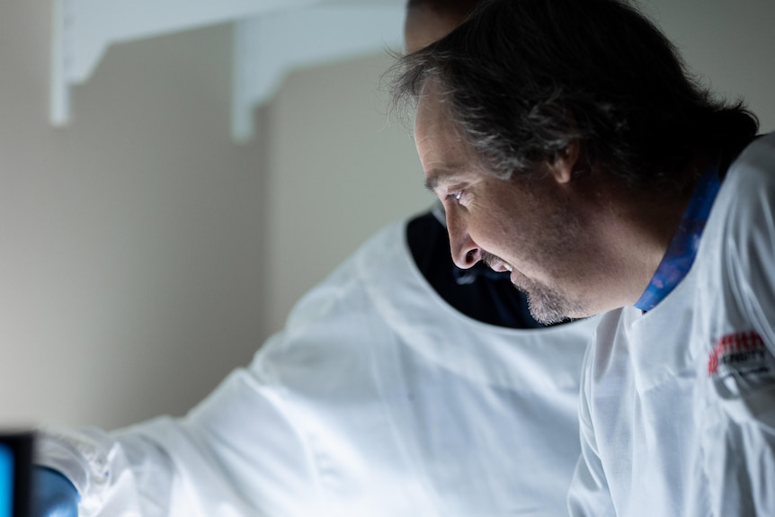 Researcher Professor Kevin Morris works in a lab.