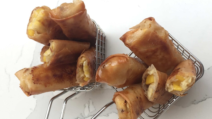 Two small frying baskets of deep-fried turon