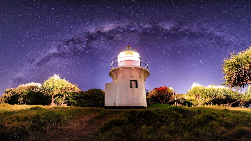 Milky Way arc over a little lighthouse