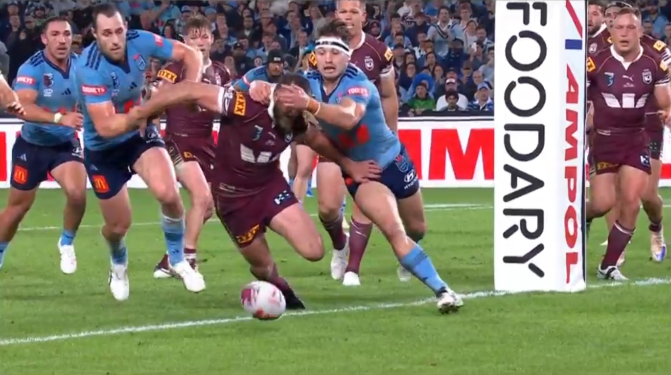 A screenshot of Cameron Murray holding back Kurt Capewell during State of Origin I.