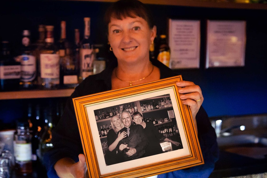 Mary-Jane Liddicoat holds up a photoshopped picture with her and Malcolm Turnbull.
