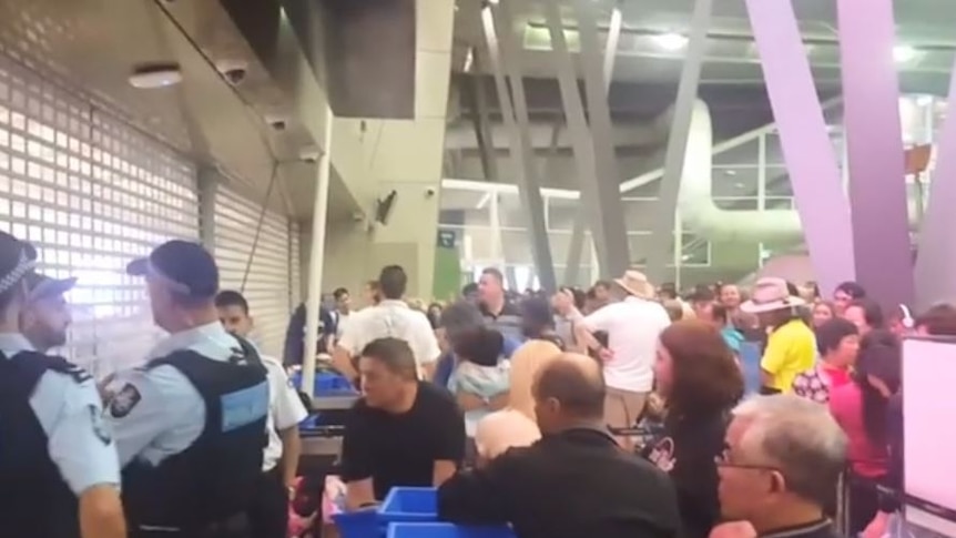 Crowds locked out of airport security.