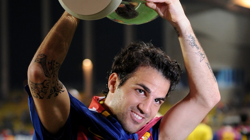 Fabregas holds the European Super Cup