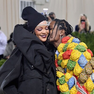 A$AP Rocky kisses Rihanna on the MET red carpet