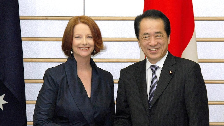 Julia Gillard shakes hands with Naoto Kan