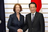 Julia Gillard shakes hands with Naoto Kan
