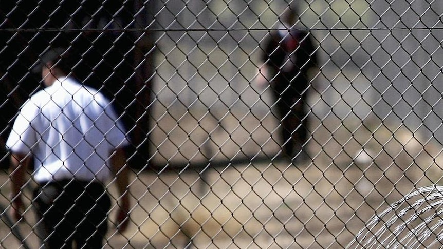 Security guards patrol the grounds at the Villawood Immigration Detention Centre