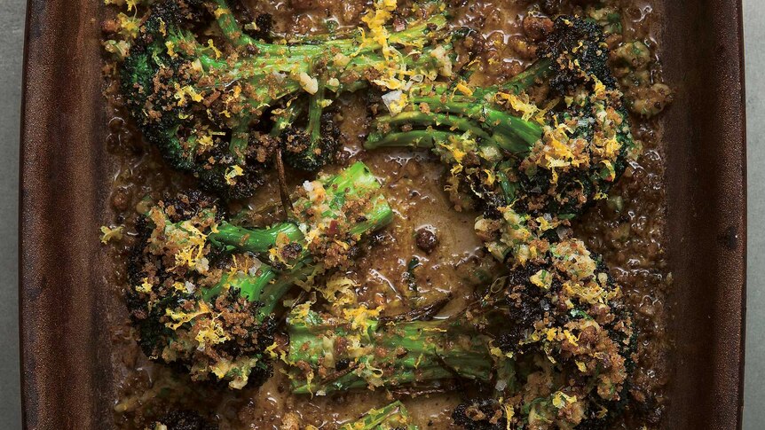 Charred Whole Broccoli with Miso Bagna Cauda in a baking dish, taken from 'On Vegetables: Modern Recipes for the Home Kitchen'.