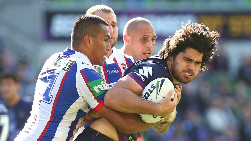 Tohu Harris is wrapped up by the Knights defence