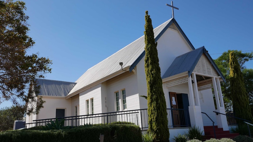 The exterior of a small white rural church in the WA Wheatbelt